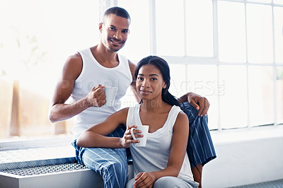 Buy stock photo Cropped shot of a young couple enjoying their morning at home