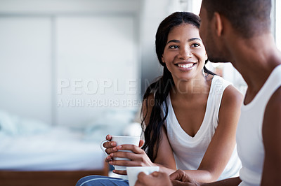 Buy stock photo Cropped shot of a young couple enjoying their morning at home