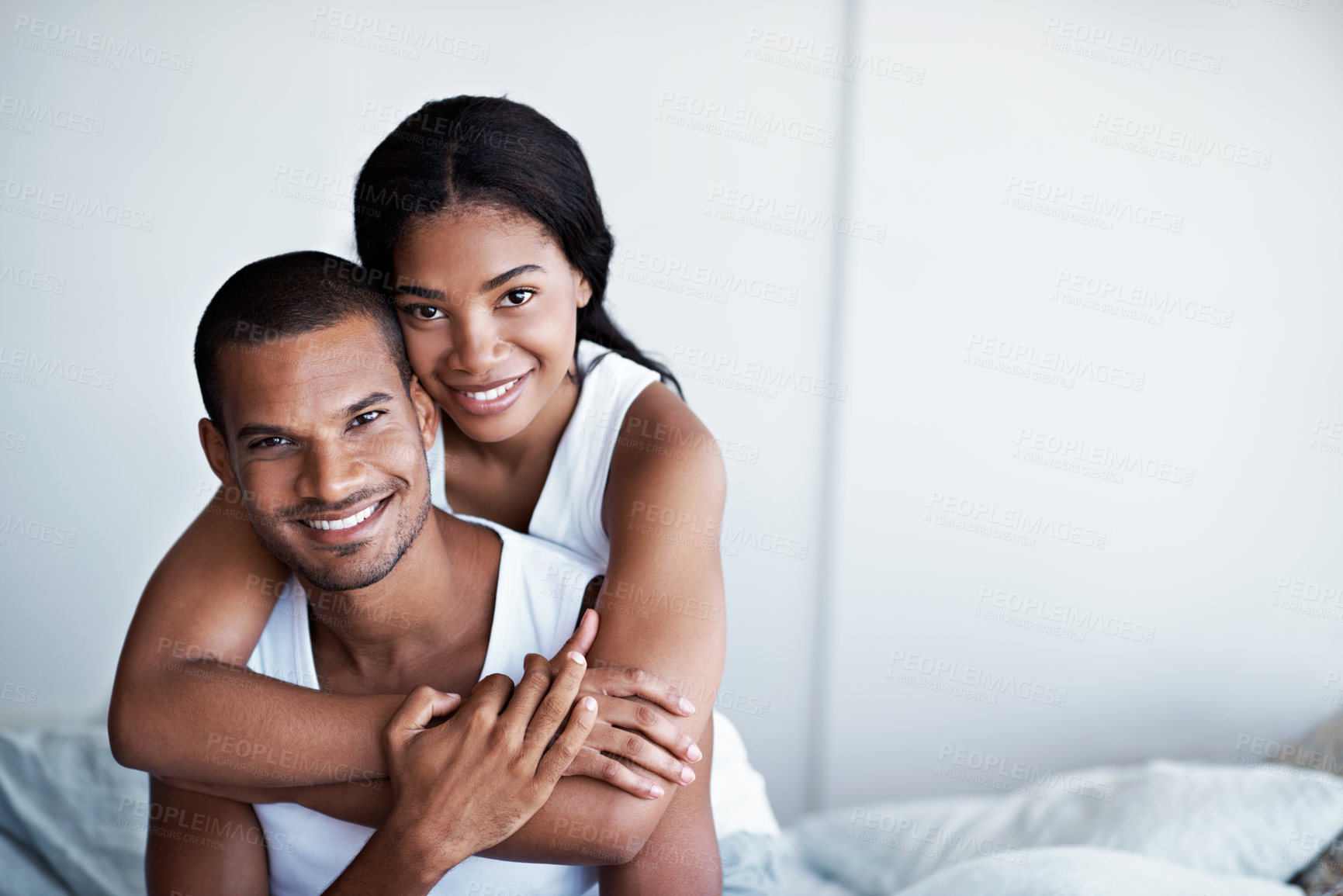 Buy stock photo Portrait, bedroom and couple hug in morning for bonding, relationship and connection on weekend. Happy, home and woman with man embrace for affection, commitment and smile for love, trust and support