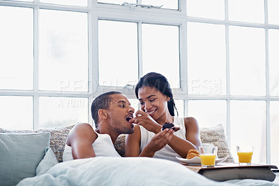 Buy stock photo Cropped shot of a young couple enjoying their morning at home