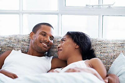 Buy stock photo Cropped shot of a young couple enjoying their morning at home