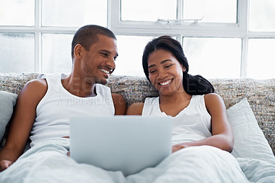 Buy stock photo Cropped shot of a young couple enjoying their morning at home