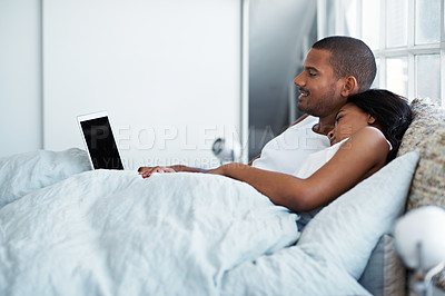Buy stock photo Cropped shot of a young couple enjoying their morning at home