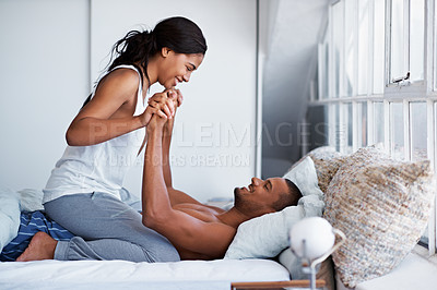 Buy stock photo Cropped shot of a young couple enjoying their morning at home