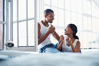 Buy stock photo Cropped shot of a young couple enjoying their morning at home