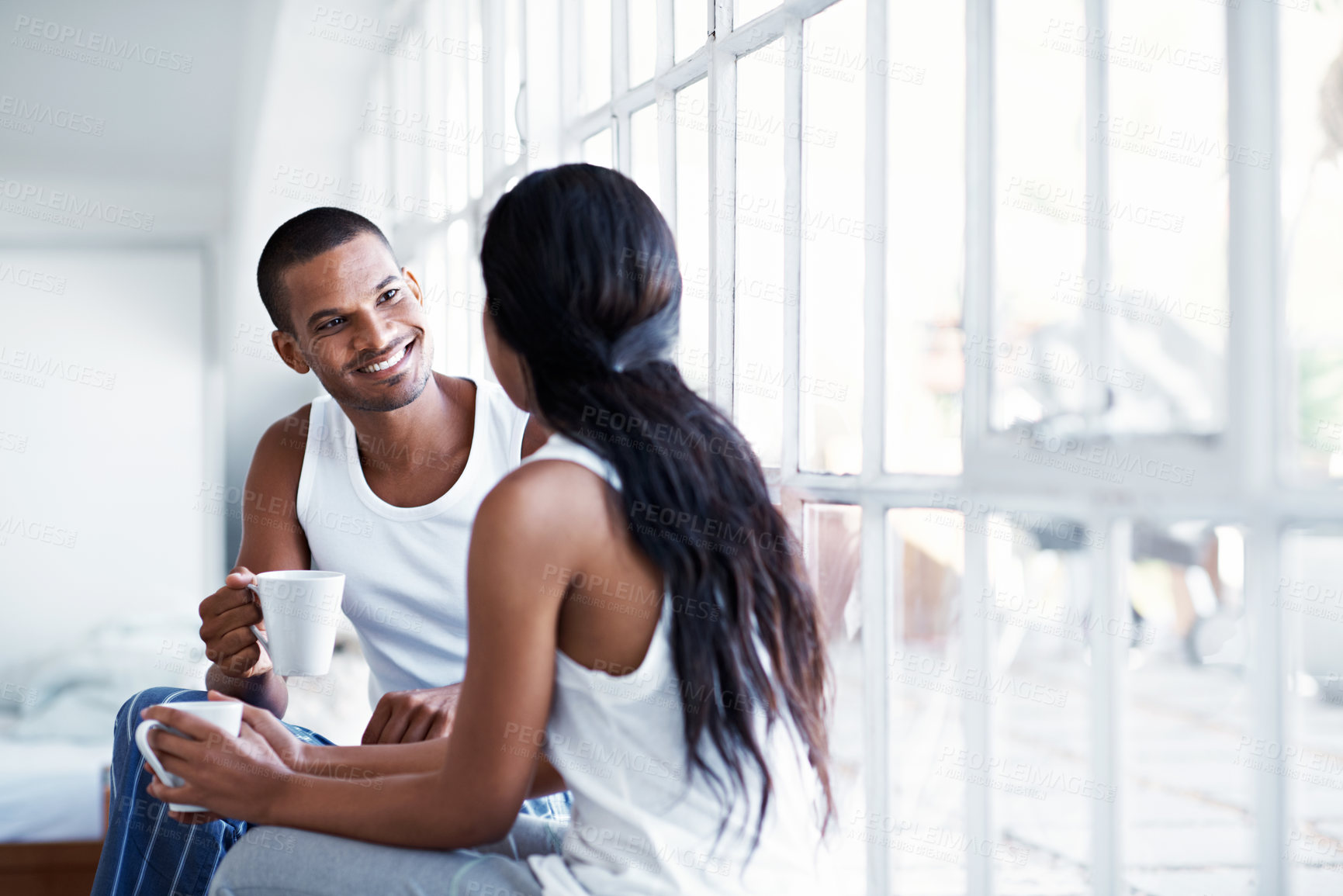 Buy stock photo Conversation, morning and couple with coffee in home for bonding, connection and relationship. Happy, house and man with woman for talking, communication and drink for love, trust and chat on weekend