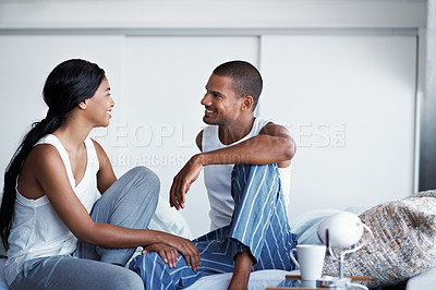 Buy stock photo Cropped shot of a young couple enjoying their morning at home