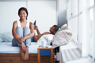 Buy stock photo Shot of a young couple enjoying their morning at home