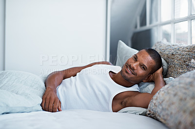 Buy stock photo Cropped shot of a young man using lying in bed