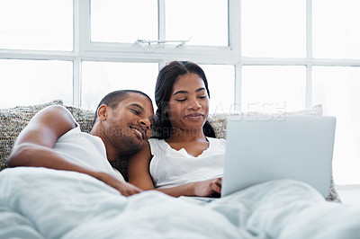 Buy stock photo Cropped shot of a young couple enjoying their morning at home