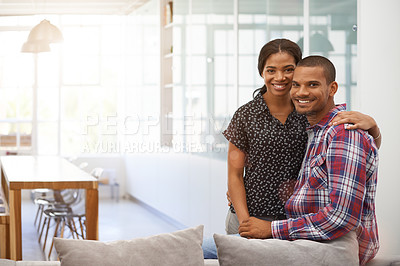 Buy stock photo Cropped portrait of an affectionate young couple in their living room