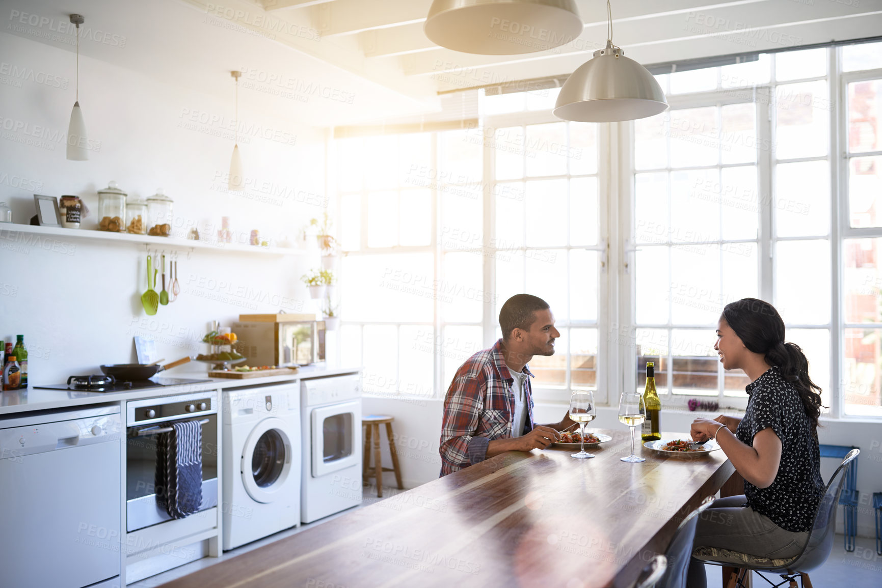 Buy stock photo Eating, meal and couple in home for date, bonding or connection in marriage for anniversary. Wine, food and man with woman for supper or dinner together for relationship celebration in apartment.
