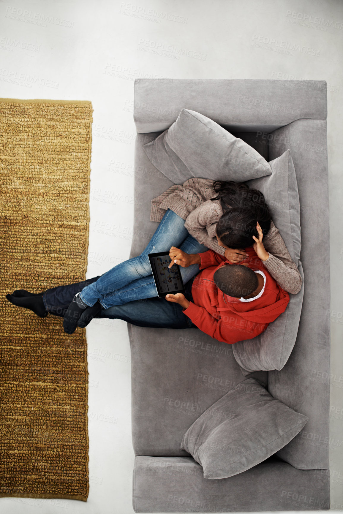 Buy stock photo Home, above and couple on sofa with tablet, online entertainment and streaming in lounge. Video subscription, people and tech screen on couch for website, film and relax or bonding together for love