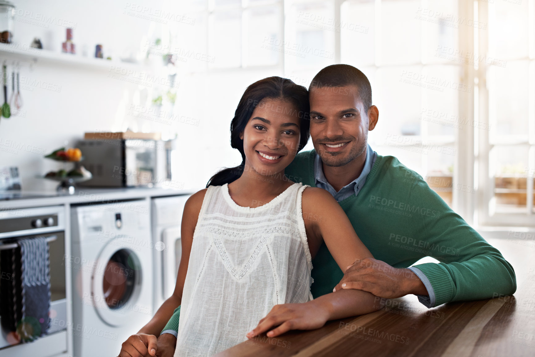 Buy stock photo African couple, portrait and love with smile in kitchen for bonding, relationship or holiday together. Relax, happy man and woman with break for comfort, support and morning with embrace in house