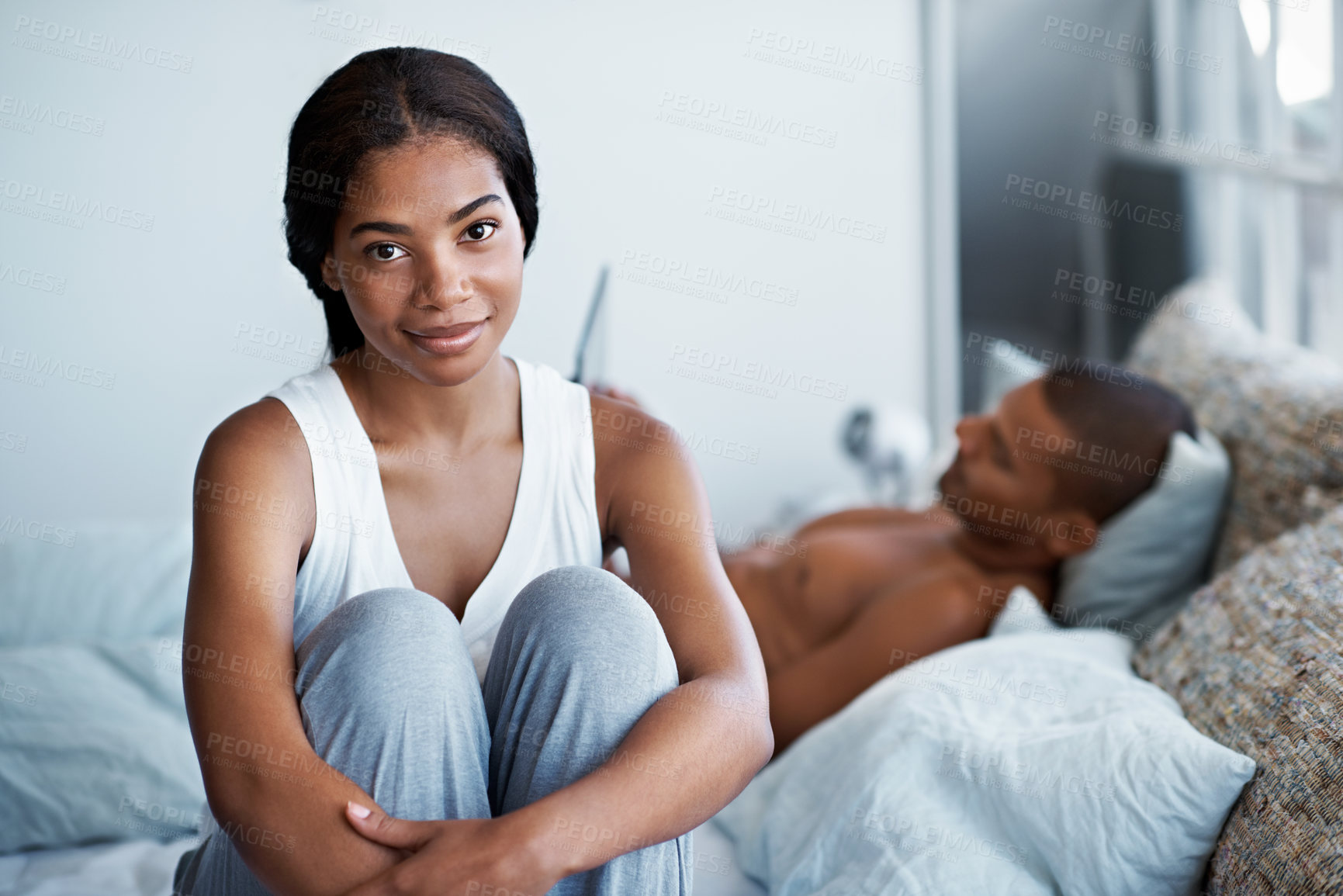 Buy stock photo Relax, couple and portrait of woman on bed in home with bonding, love and connection in marriage. Smile, calm and people in bedroom for weekend together with commitment, care and relationship trust.