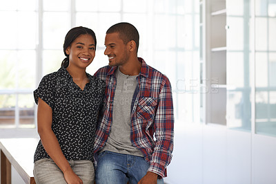 Buy stock photo Portrait of a happy couple leaning on their dining table