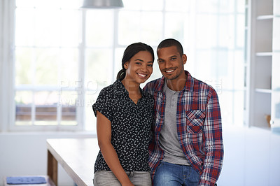 Buy stock photo Portrait of a happy couple leaning on their dining table