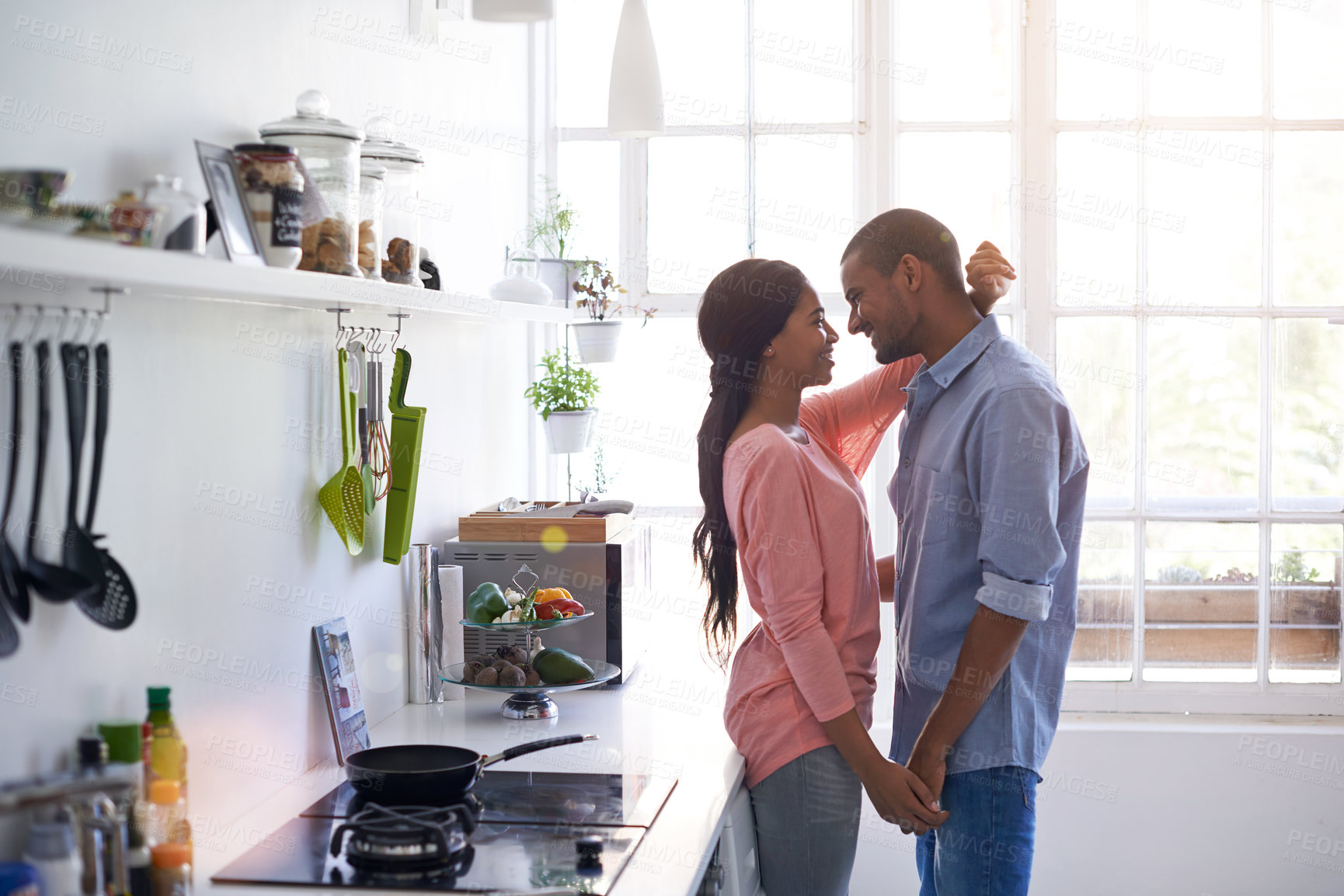 Buy stock photo Couple, happy and hug in kitchen with love, relationship security and trust with commitment. Woman, man and holding hands in home with care, bonding and safety connection with emotional support