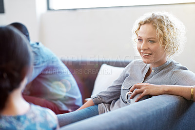 Buy stock photo Shot of a group of coworkers talking together in a modern office