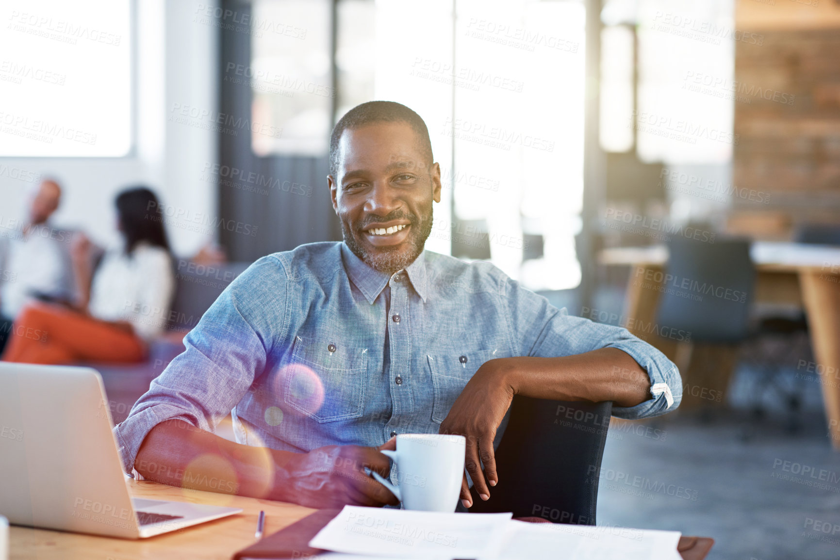 Buy stock photo Portrait, laptop and happy man with coffee in office for productive morning or creative design. Male person, designer or employee with smile, computer or drink for career, rest or break in workplace