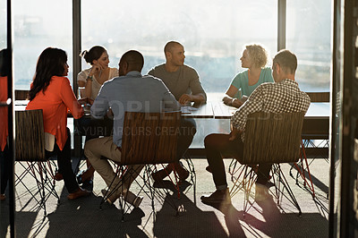 Buy stock photo Shot of a group of colleagues having a meeting together in a boardroom