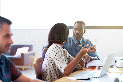 Buy stock photo Shot of two professional businesspeople working together in the office