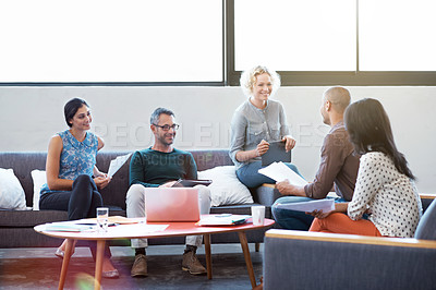 Buy stock photo Shot of a group of professional businesspeople meeting in the office