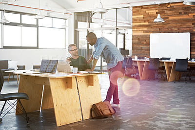 Buy stock photo Shot of two mature businessmen working in a creative office