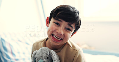 Buy stock photo Hug, portrait and smile of boy with teddy bear in home bedroom for comfort, development or growth. Happy, love and youth with excited child embracing stuffed animal on bed in apartment for security