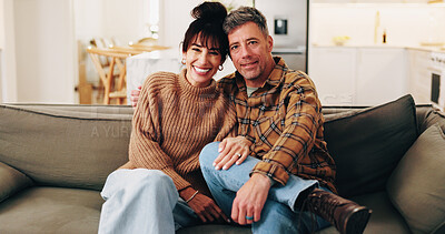 Buy stock photo Smile, couple and relax in home with hug, love and romance for bonding together in lounge. Portrait, mature people and rest on sofa with embrace, partner affection and weekend for romantic connection