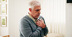 Senior, man and home with chest pain for cardiac arrest, respiratory infection or disease. Elderly, male person or patient breathing with heart ache, chronic stress or high blood pressure in house