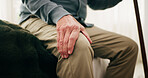 Senior, man and hands with knee pain on bed for Parkinsons, arthritis or joint inflammation in home. Elderly, male person or sore leg with cane, injury or discomfort in bedroom for strain or pressure
