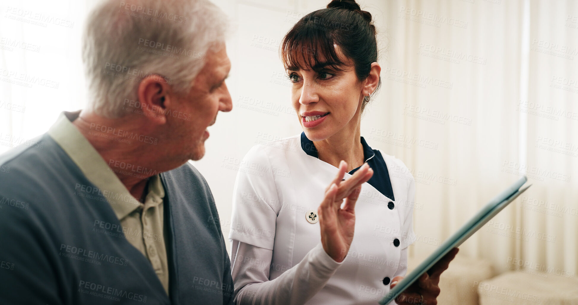 Buy stock photo Caregiver, tablet and old man in nursing home with conversation, medical advice and tips for wellness. Nurse, senior person and talk in retirement center with tech, healthcare records and assistance.
