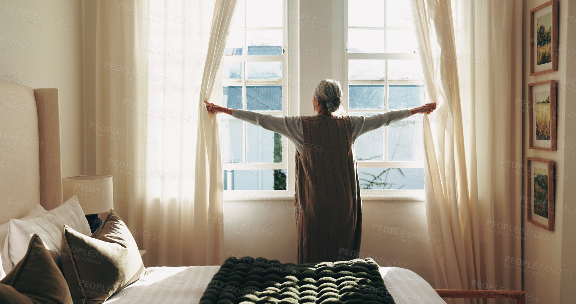 Buy stock photo Senior, woman and open curtains in retirement home for morning reflection, getting ready or daylight. Back, elderly person and wake up by bedroom window with drapes, thinking and housework routine.
