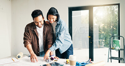 Buy stock photo Blueprint, home improvement and pointing with couple at table for discussion or project planning. Conversation, diy and renovation with happy people in new house for construction or interior design