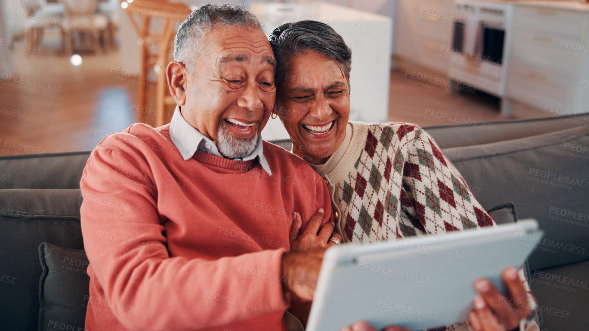 Buy stock photo Senior couple, laughing and relax with tablet in lounge, online and streaming film with subscription. Retirement, home and happy people with tech for funny movies, bonding and watching series on sofa