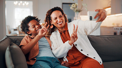 Buy stock photo Mother, son and peace sign in home with selfie, smile or social media post for childhood memories. Happy, African woman and child in living room with photography, v gesture or family bonding together