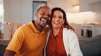 Portrait, hug and mature couple in home with laugh, funny joke and bonding together for relationship. Happy, married African people and embrace in living room with love, humor or romantic connection.