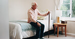 Thinking, relax and senior man in bedroom at house for reflection, remember or retirement memory. Walking stick, nostalgia and elderly person with dementia on bed with ideas for pension funds in home