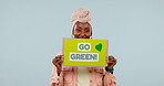 Poster, portrait and woman in studio for recycling, go green and support for climate change on mockup space. Happy, sign and African person for environmental care, sustainability and blue background