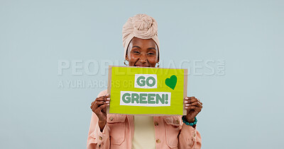 Buy stock photo Poster, portrait and woman in studio for recycling, go green and support for climate change on mockup space. Happy, sign and African person for environmental care, sustainability and blue background