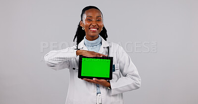 Buy stock photo Green screen, tablet and portrait of doctor in studio for medical service, health app and mockup. Happy, space and black woman on tech for advertising, healthcare and telehealth on white background