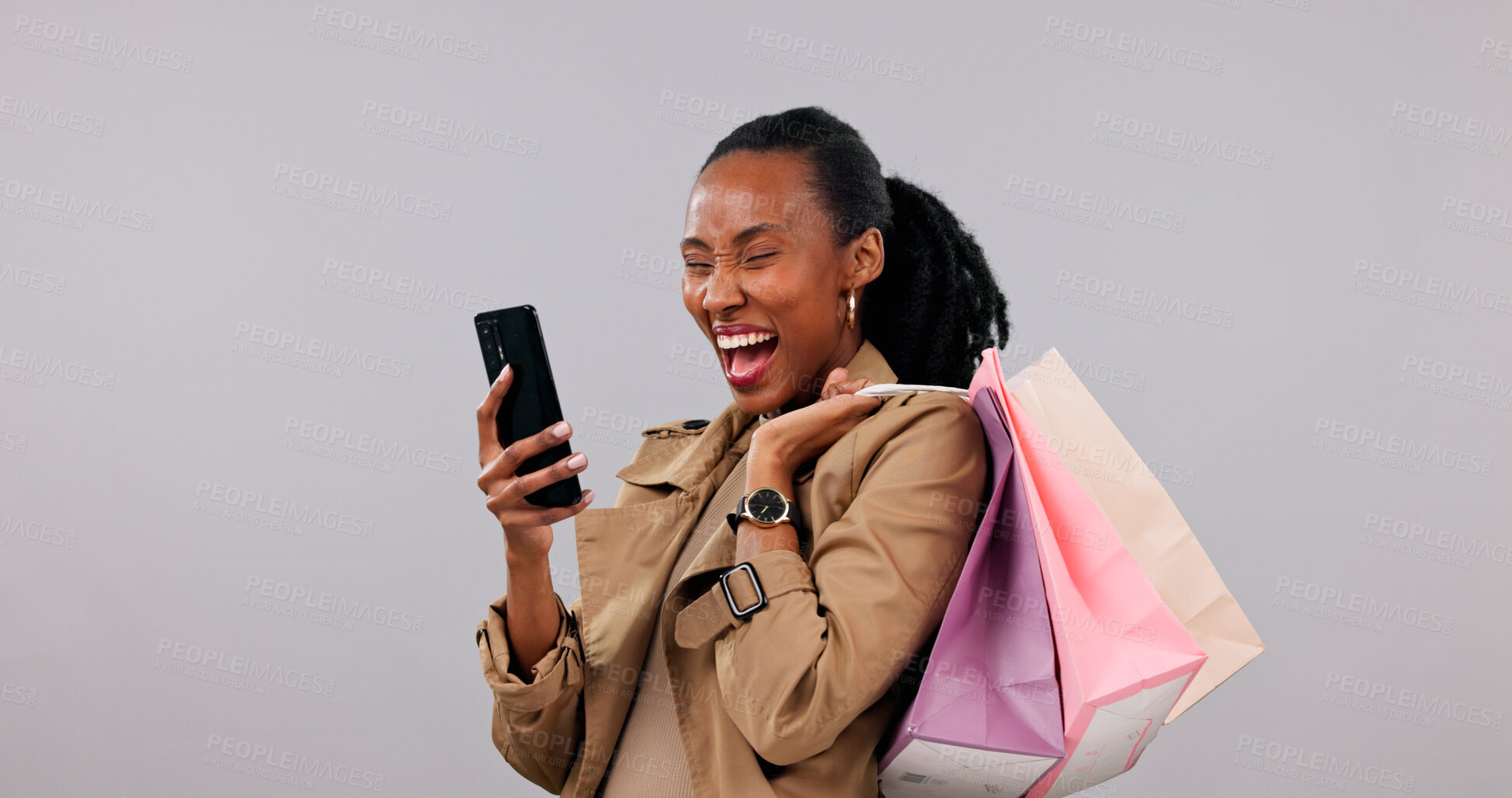 Buy stock photo Studio, shopping bags and woman with phone, laughing and good news on social media and notification. White background, customer and black person with mobile, space and happy for discount offer on web