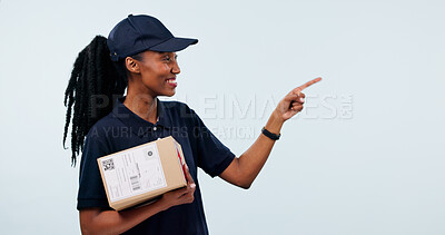 Buy stock photo Pointing, delivery and woman with space in studio for shipping, courier service and ecommerce info. Mockup, happy and African person with box for supply chain, logistics and news on white background