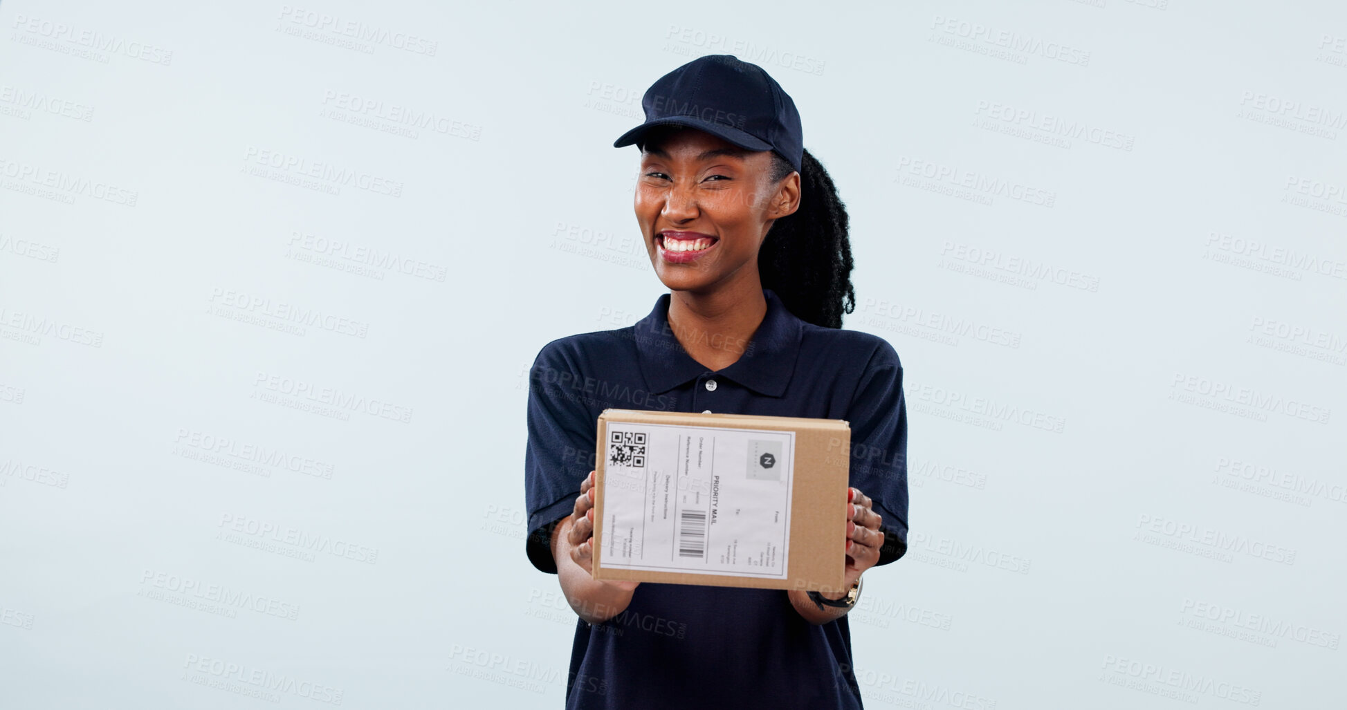 Buy stock photo Box, black woman and portrait of courier in studio by space for distribution, delivery or cargo. Happy, package and logistics worker with cardboard parcel for supply chain on white background.