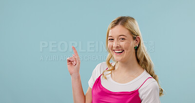 Buy stock photo Mockup, pointing and fashion with portrait of woman in studio for announcement, retail news and space. Sale promotion, style advertising and happy with female person on blue background for offer