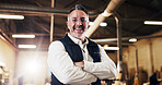 Carpentry, portrait or man in factory with arms crossed, craftsman or pride in furniture business. Smile, flare or mature carpenter with confidence, woodworking or about us as lumber contractor.