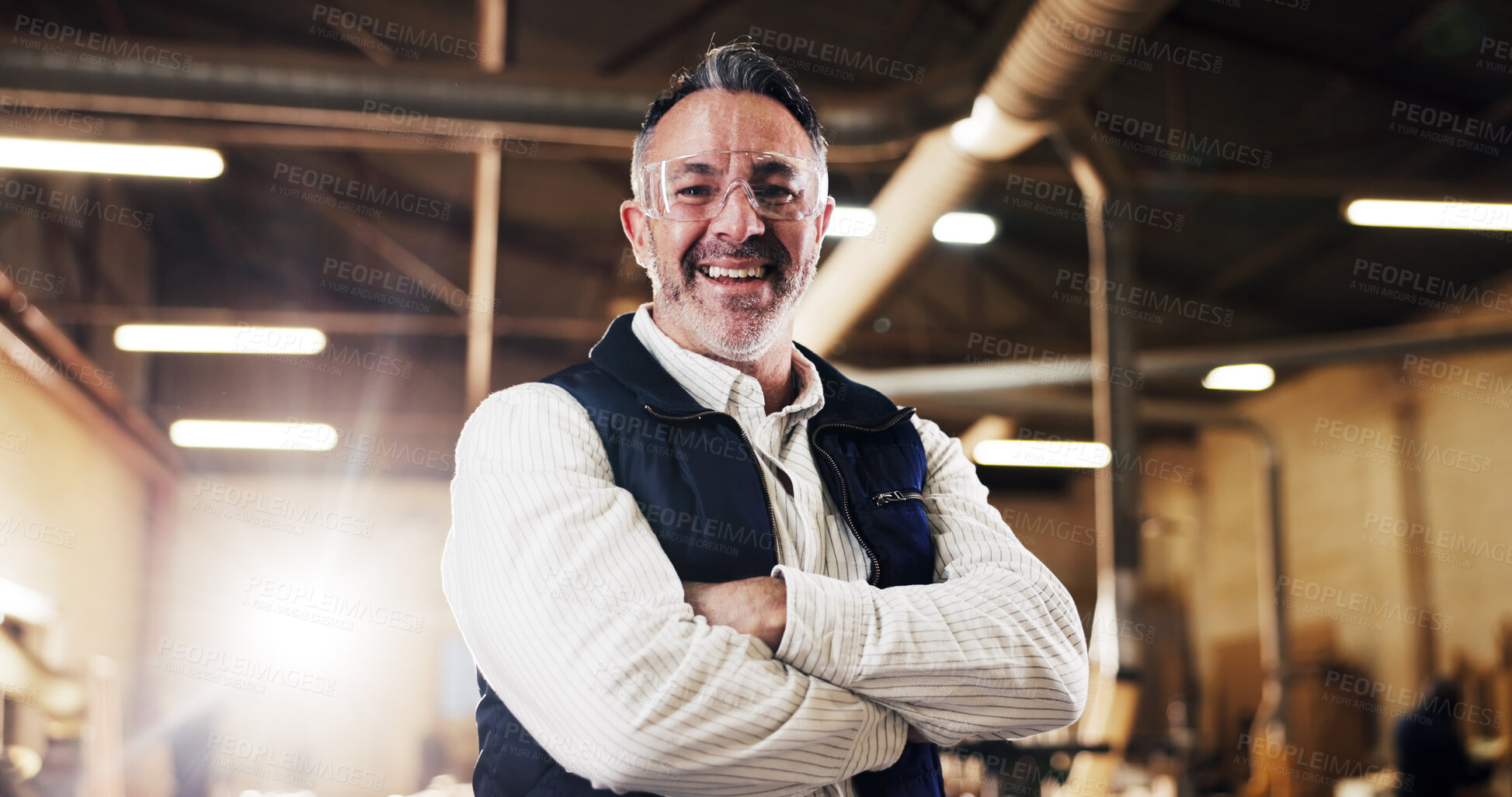 Buy stock photo Carpentry, portrait or man in factory with arms crossed, craftsman or pride in furniture business. Smile, goggles or mature carpenter with confidence, woodworking or about us as lumber contractor.
