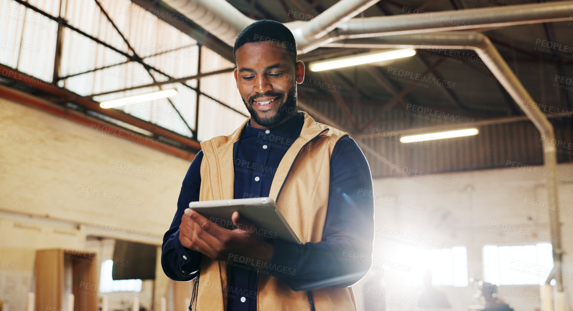 Buy stock photo Carpentry, review or black man in factory with tablet, order brief or stock control in furniture business. Flare, smile or artisan with tech, delivery checklist or inventory management in woodworking