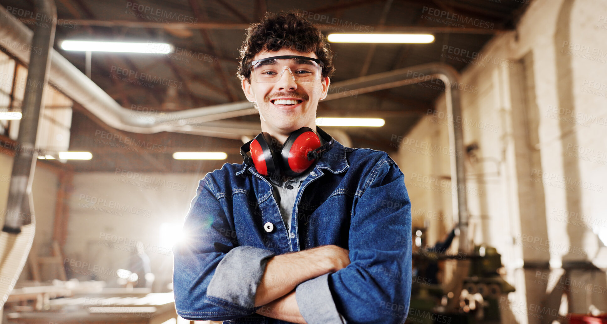 Buy stock photo Carpentry, portrait or man in workshop with arms crossed, craftsman or pride in furniture business. Happy, ppe or carpenter in factory with confidence, woodworking or about us as lumber contractor.